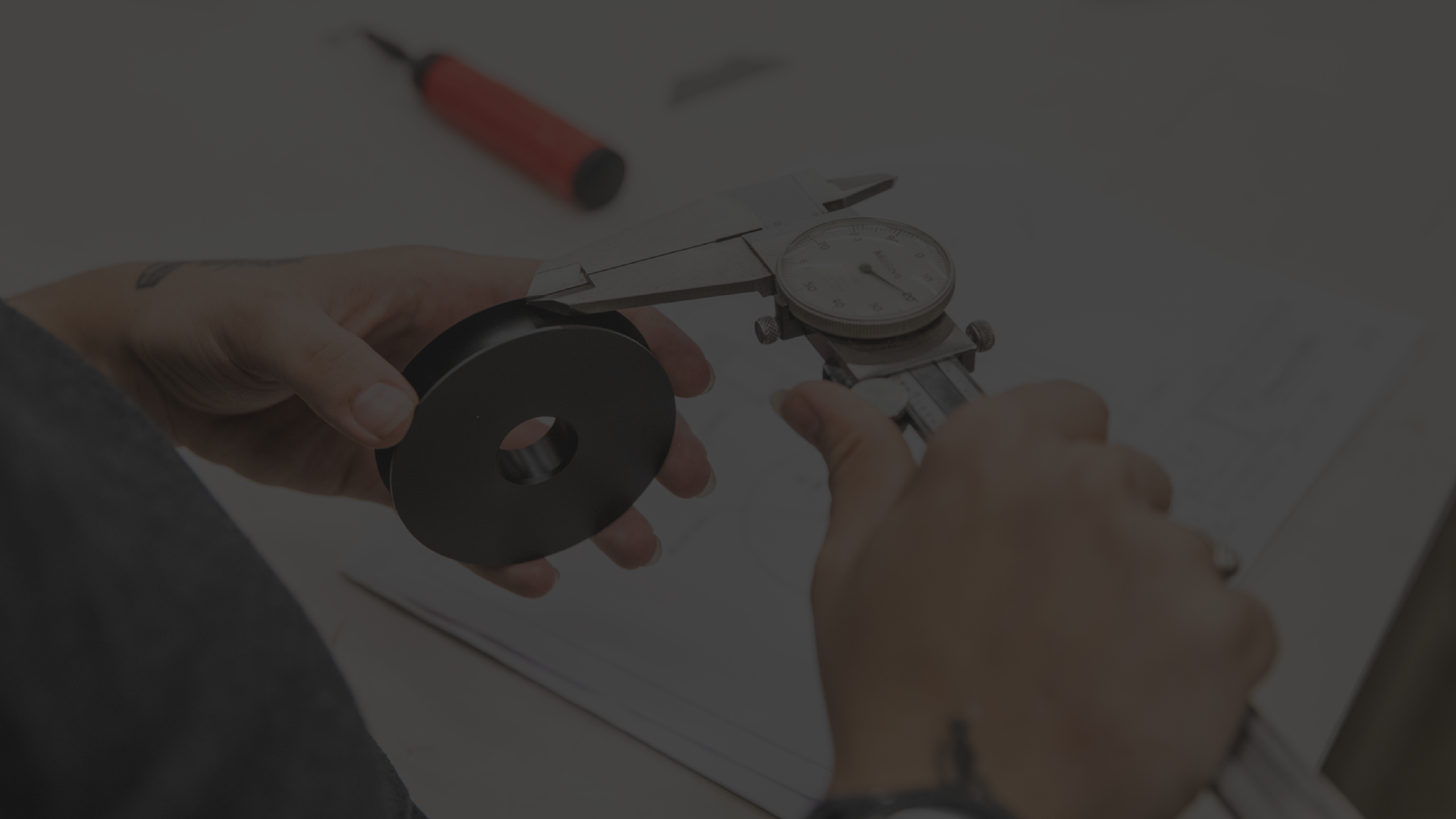 Person measuring with a caliper